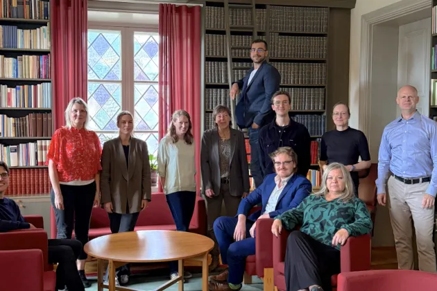 Members of consortium gathered in the library of the Old Bishop's House where the meeting took place