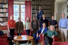 Members of consortium gathered in the library of the Old Bishop's House where the meeting took place